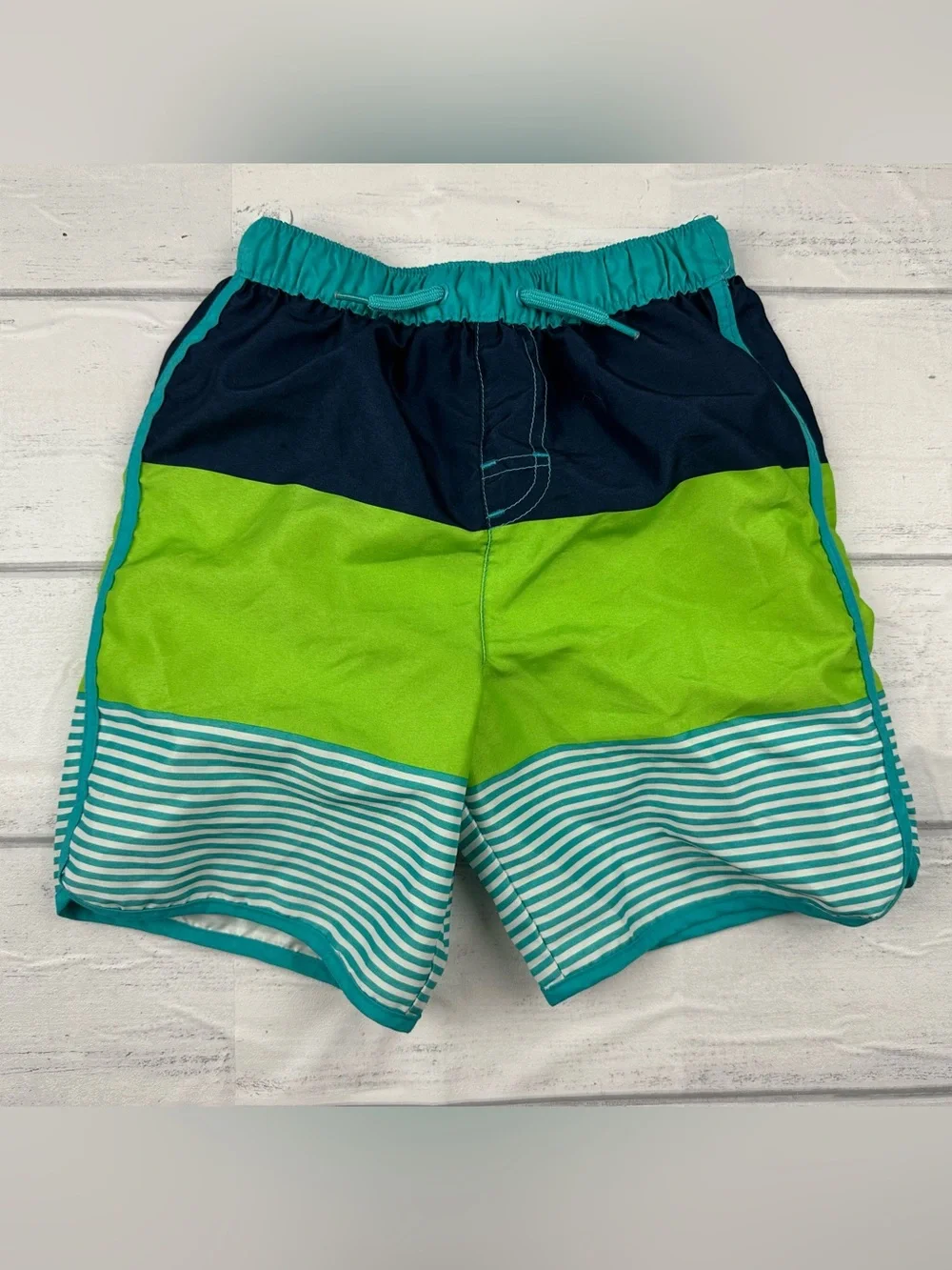 Two pairs of boys size 5t swim trunks